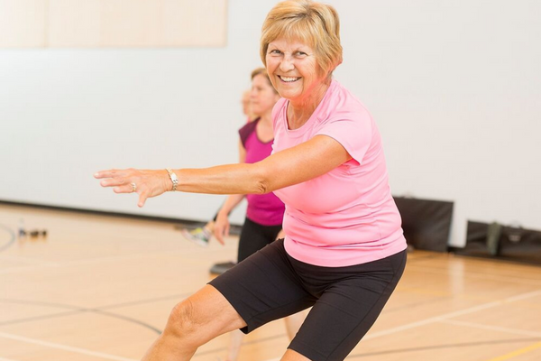 Woman smiling while working out